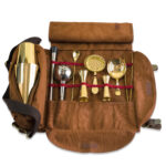 Brown Atena roll-up bag with gold mixology tools