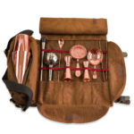 Brown Atena roll-up bag with copper mixology tools